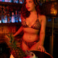 Woman in a tropical-themed setting with a pineapple decoration
