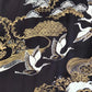 Traditional Japanese design with cranes, waves, and clouds on a black background