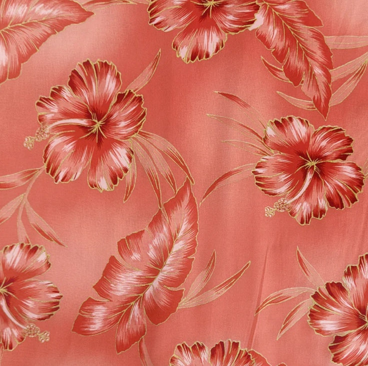Pattern of red flowers with gold accents on a coral background